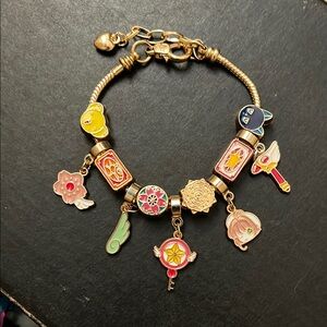Charming Gold and Multicolor Charm Bracelet Sakura card capture